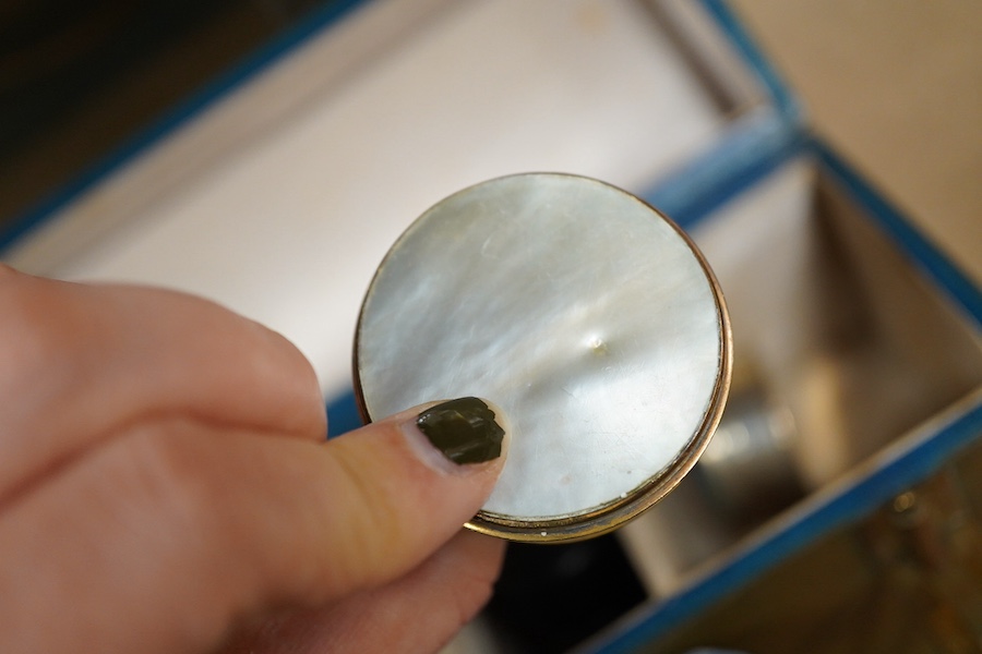 A green leather sectioned box containing a collection of cut glass, silver mounted and silver plated boxes and jars, some with guilloche enamel lids, largest 7cm high